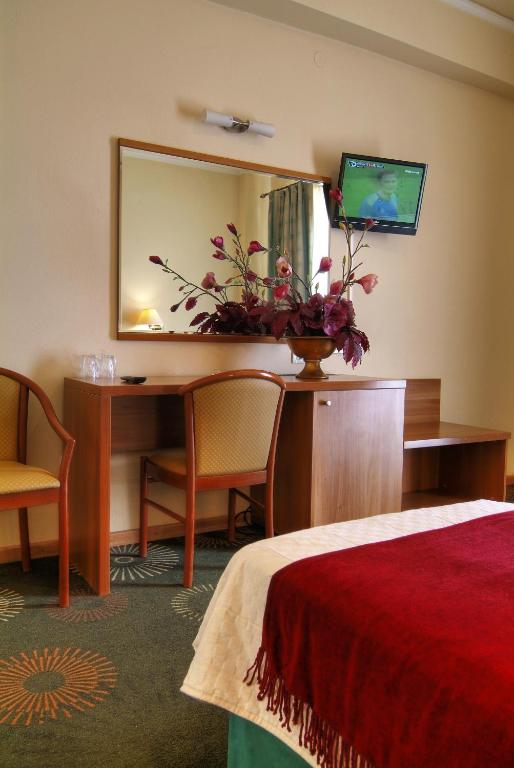 Postel nebo postele na pokoji v ubytování Hotel Kalafati