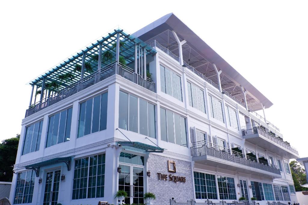 a white building with scaffolding on the side of it at The Square 101 in Bangkok