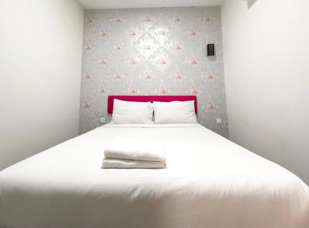 Postel nebo postele na pokoji v ubytování Carlsun Hotel