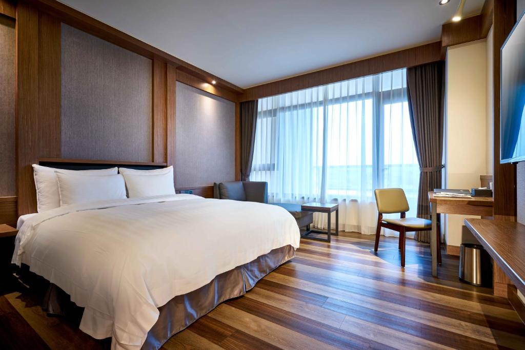 Postel nebo postele na pokoji v ubytování So Fun Hotel