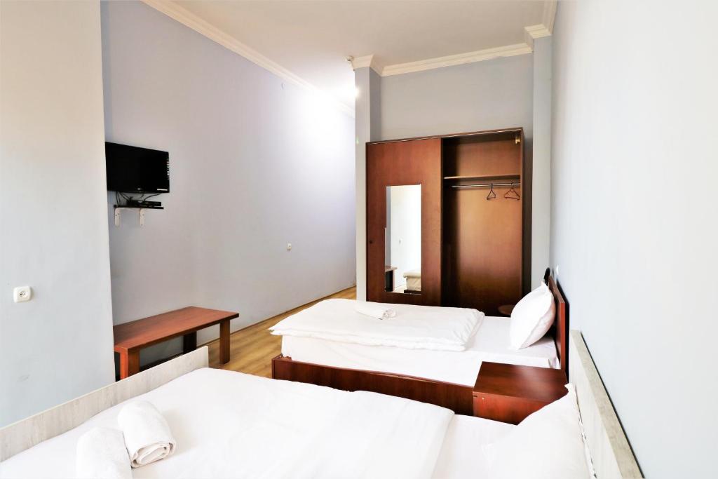 Postel nebo postele na pokoji v ubytování Ortachala Palace