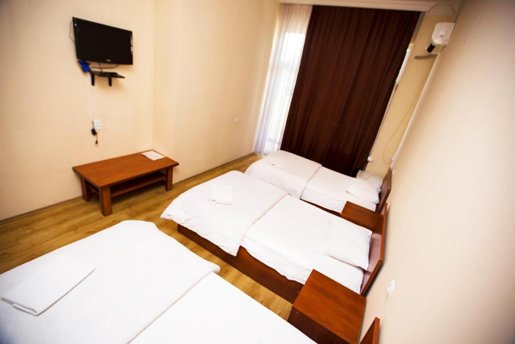 Postel nebo postele na pokoji v ubytování Ortachala Palace