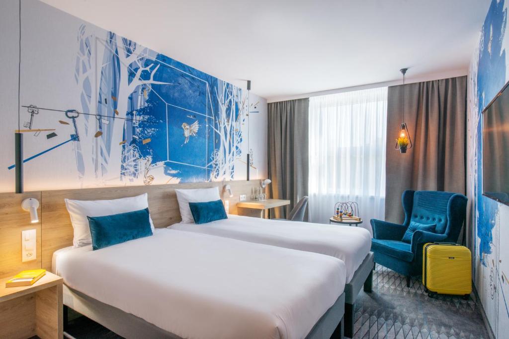 Postel nebo postele na pokoji v ubytování ibis Styles Kraków East
