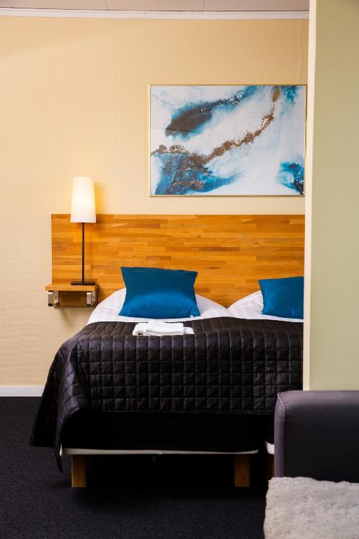 Postel nebo postele na pokoji v ubytování Hotell Veckefjärden