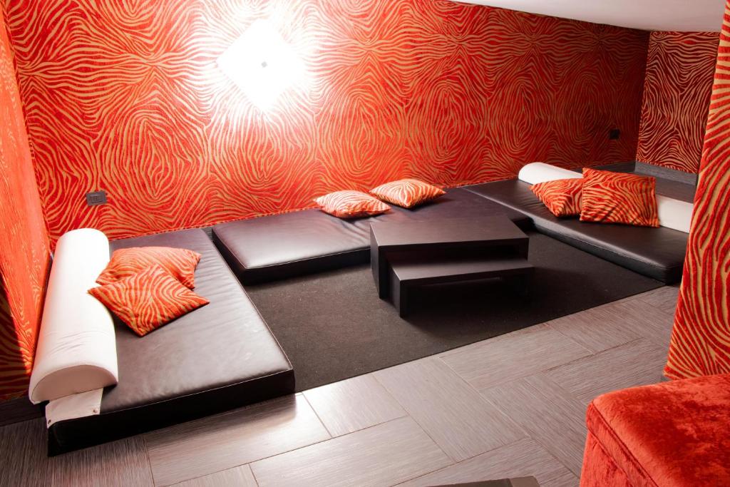 A bed or beds in a room at Hotel Masaniello Luxury