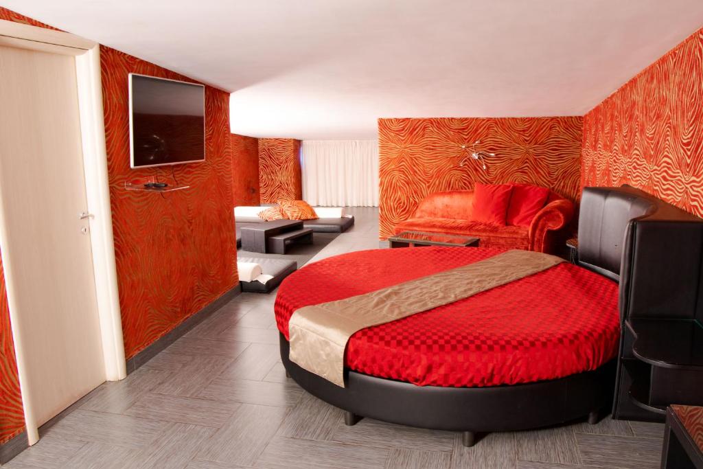 A bed or beds in a room at Hotel Masaniello Luxury