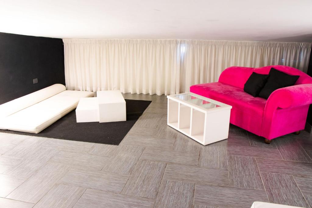 A seating area at Hotel Masaniello Luxury