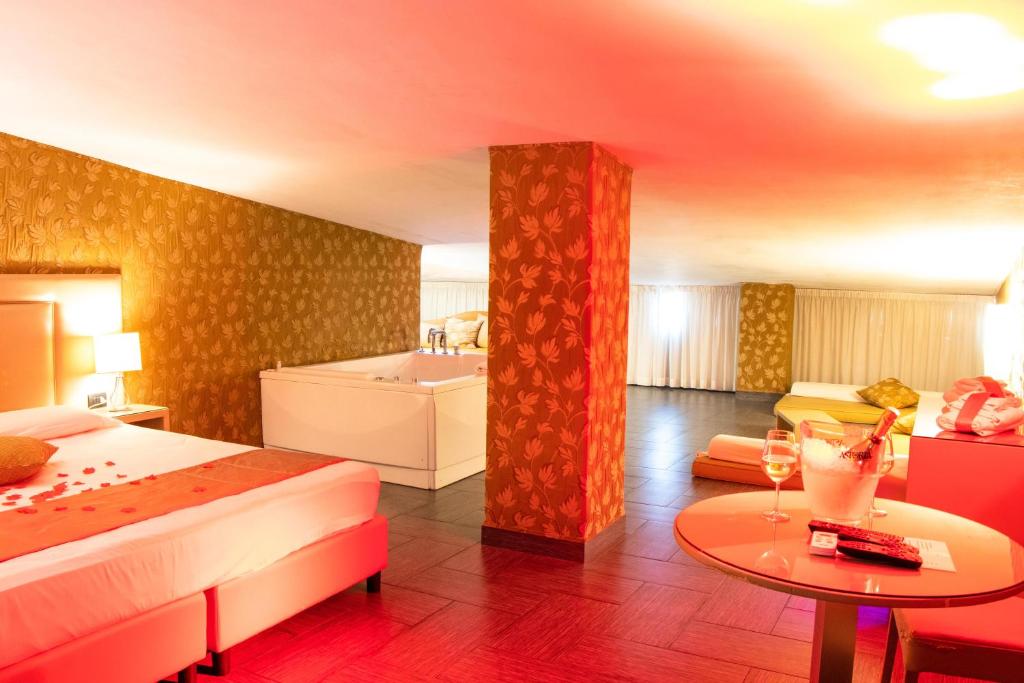 A bed or beds in a room at Hotel Masaniello Luxury
