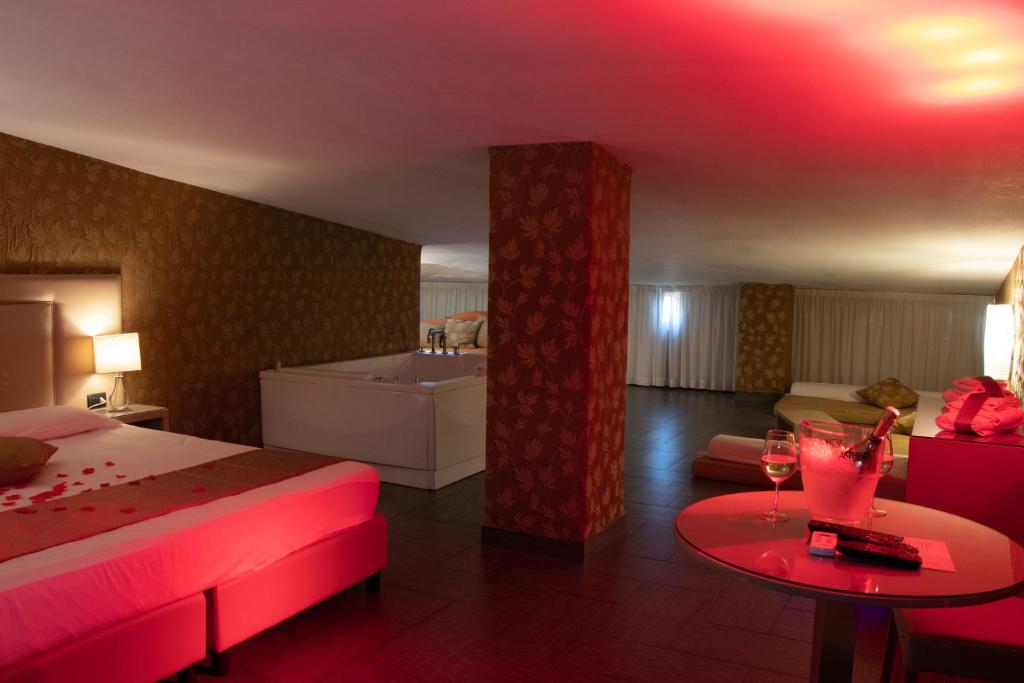 A bed or beds in a room at Hotel Masaniello Luxury