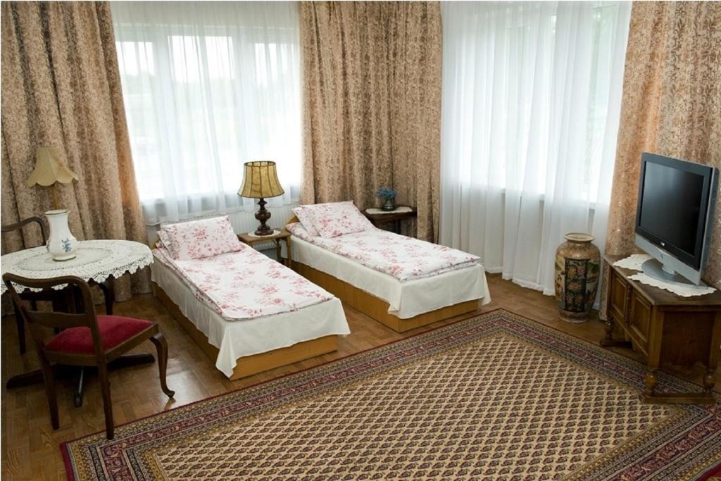 Postel nebo postele na pokoji v ubytování Willa Aida