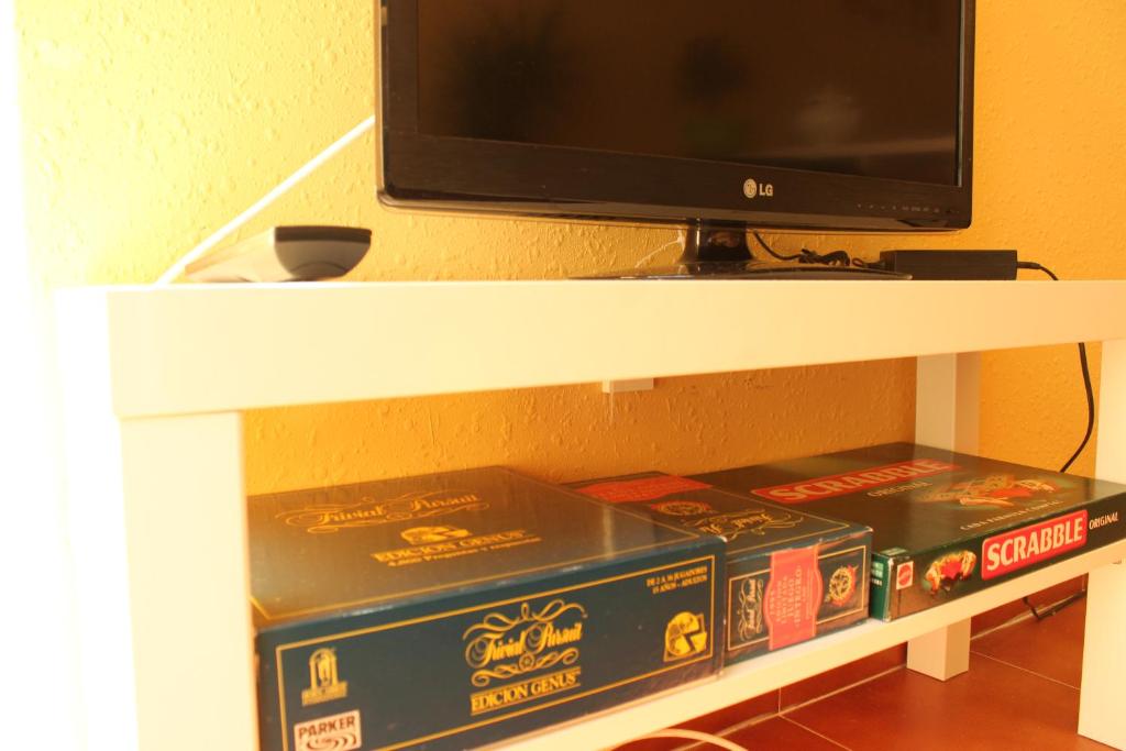 Televízia a/alebo spoločenská miestnosť v ubytovaní Apt ideal para familias cerca del mar