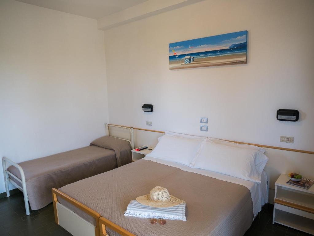 Postel nebo postele na pokoji v ubytování Hotel Pari