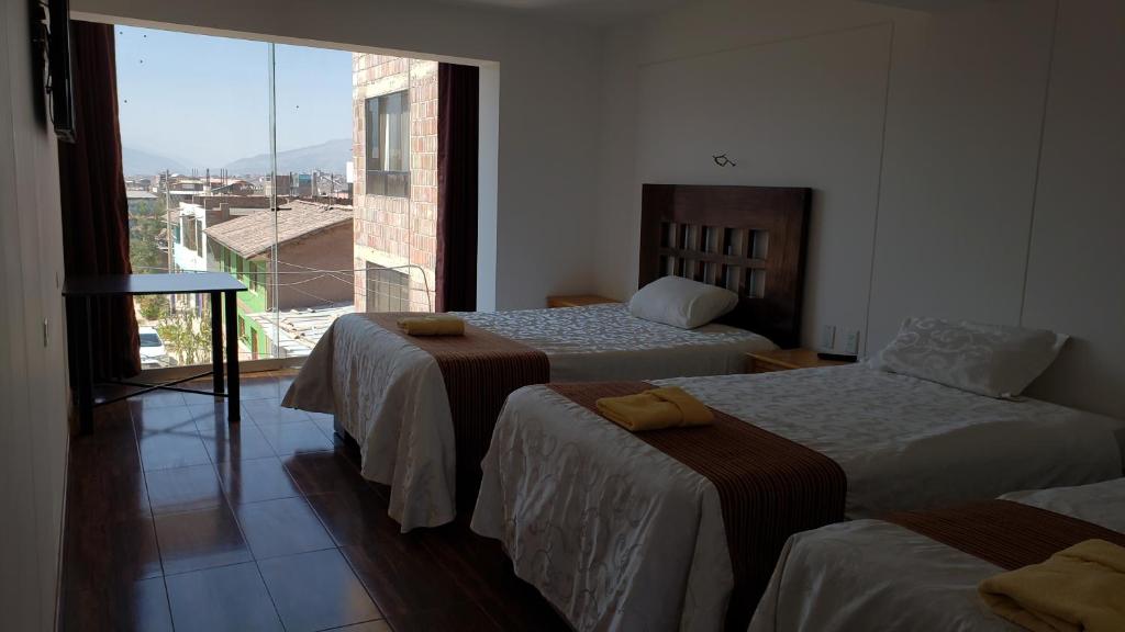 Postel nebo postele na pokoji v ubytování La Cabaña Hotel