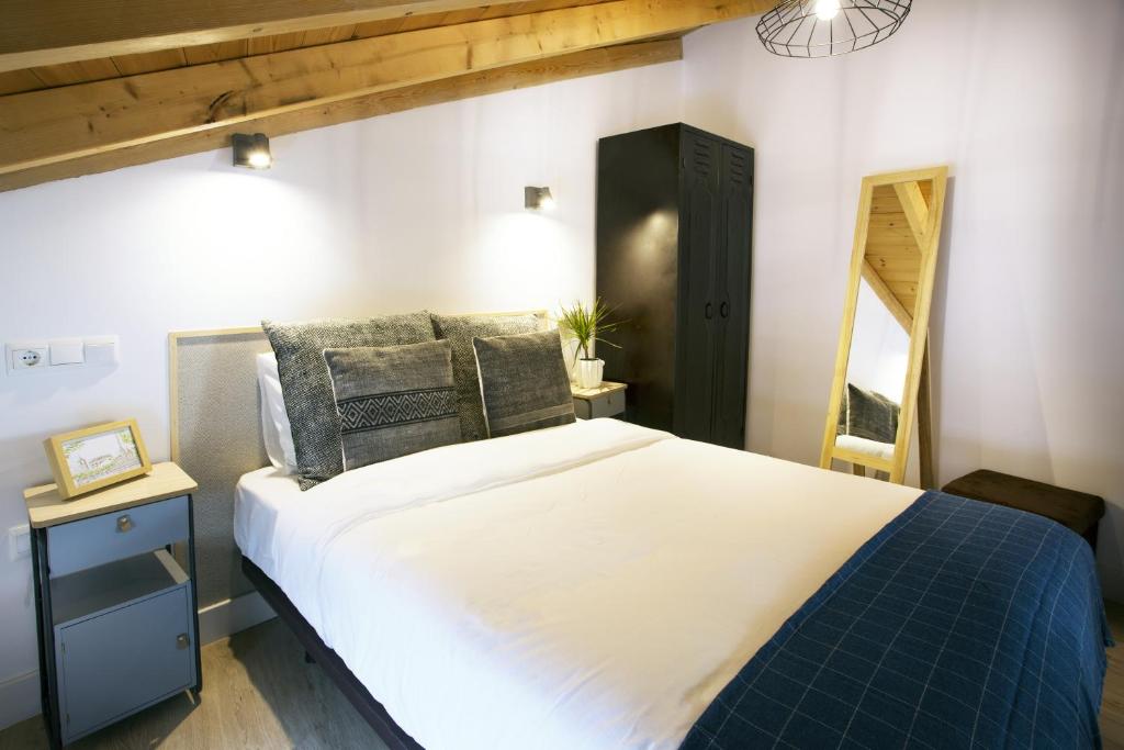 Posteľ alebo postele v izbe v ubytovaní The Loft Deluxe
