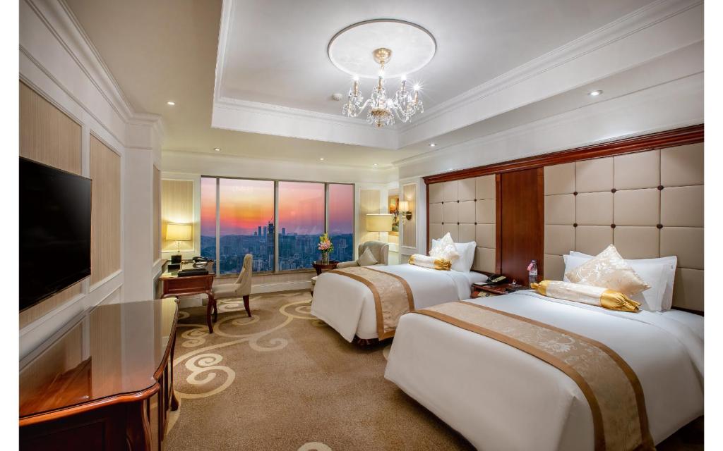 Postel nebo postele na pokoji v ubytování Kempinski Hotel Guiyang