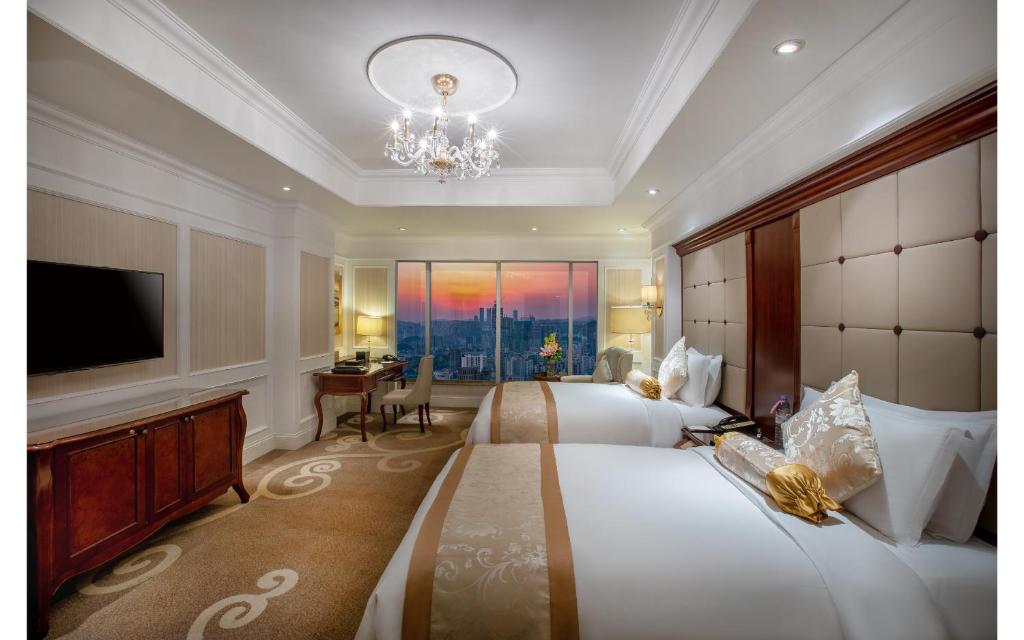 Postel nebo postele na pokoji v ubytování Kempinski Hotel Guiyang
