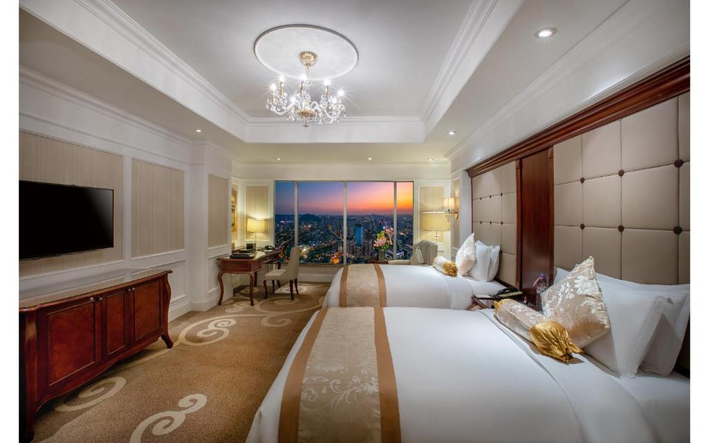 Postel nebo postele na pokoji v ubytování Kempinski Hotel Guiyang