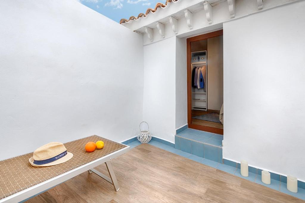 a room with a table with oranges on it at Hostal Altea House in Altea