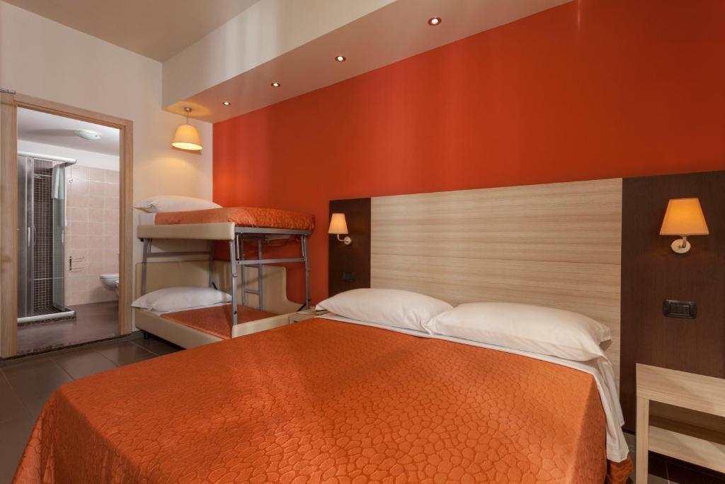Postel nebo postele na pokoji v ubytování Hotel Aurora Mare