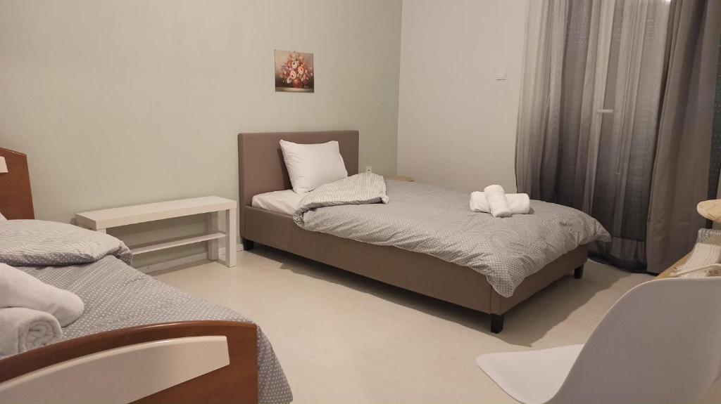 Postel nebo postele na pokoji v ubytování Deppy's Apartments