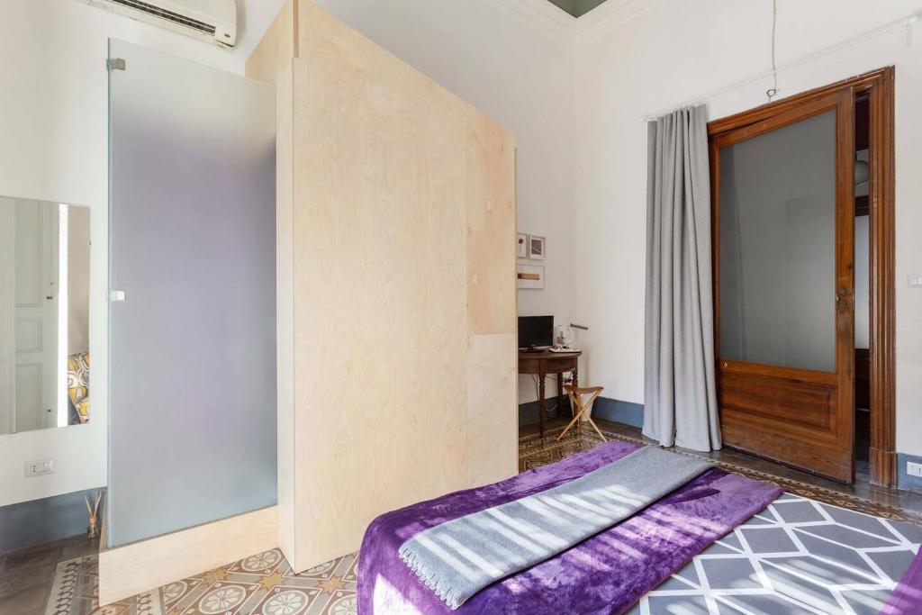 Łóżko lub łóżka w pokoju w obiekcie Trìcora Sicilian B&B