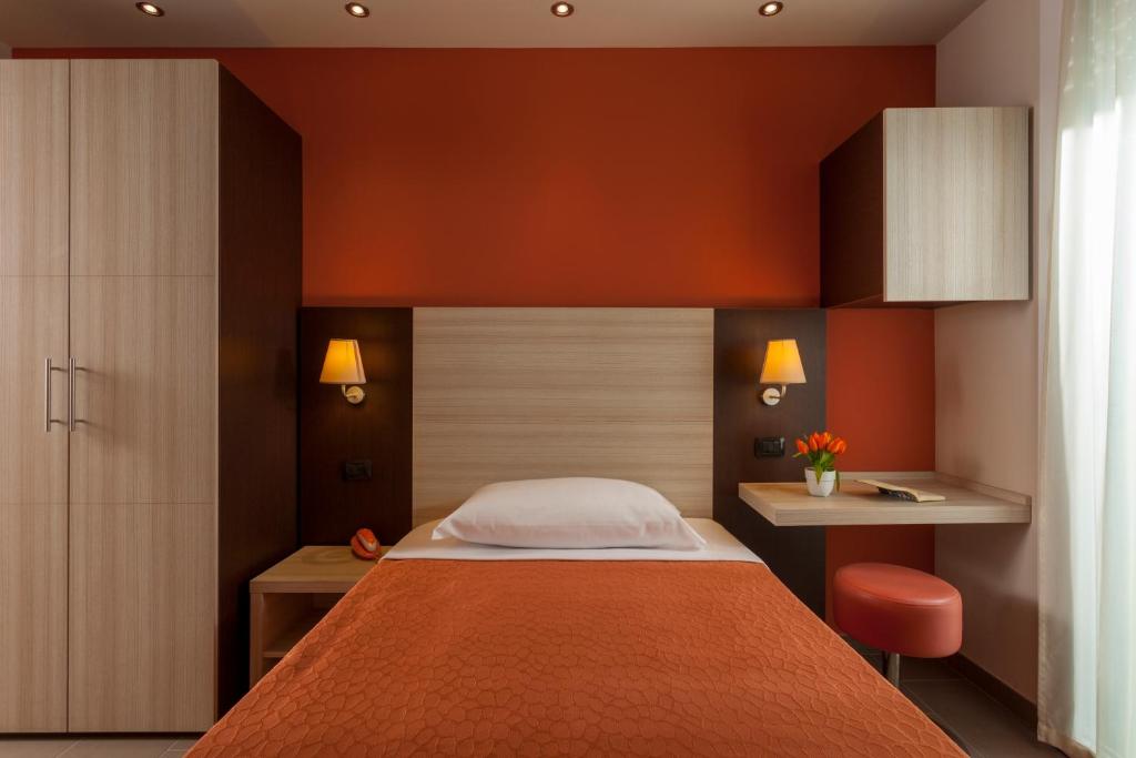 Postel nebo postele na pokoji v ubytování Hotel Aurora Mare
