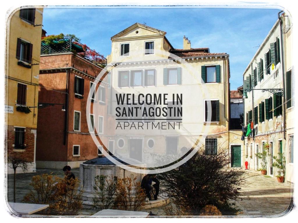 a mirror with a sign that reads welcome in santago apartment at Sant'Agostin Apartment in Venice