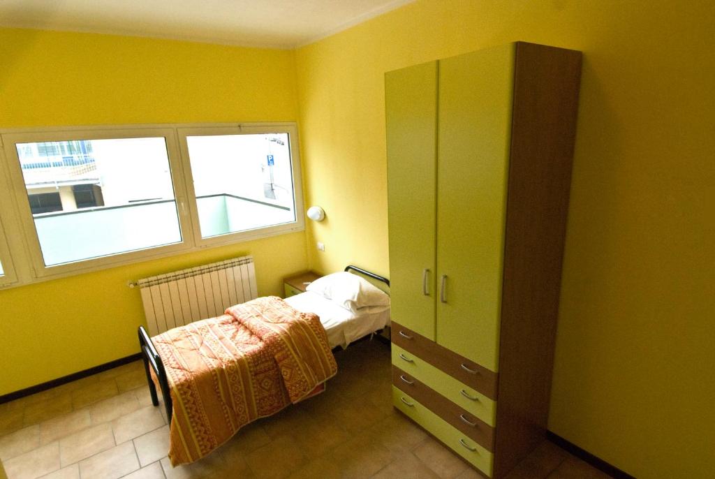 Postel nebo postele na pokoji v ubytování Casthello Ostello di Vallecamonica