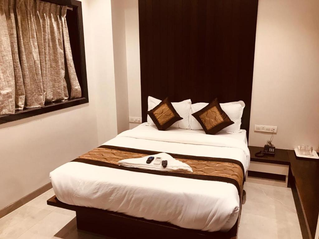 Postel nebo postele na pokoji v ubytování Hotel Flora Suites - Fort