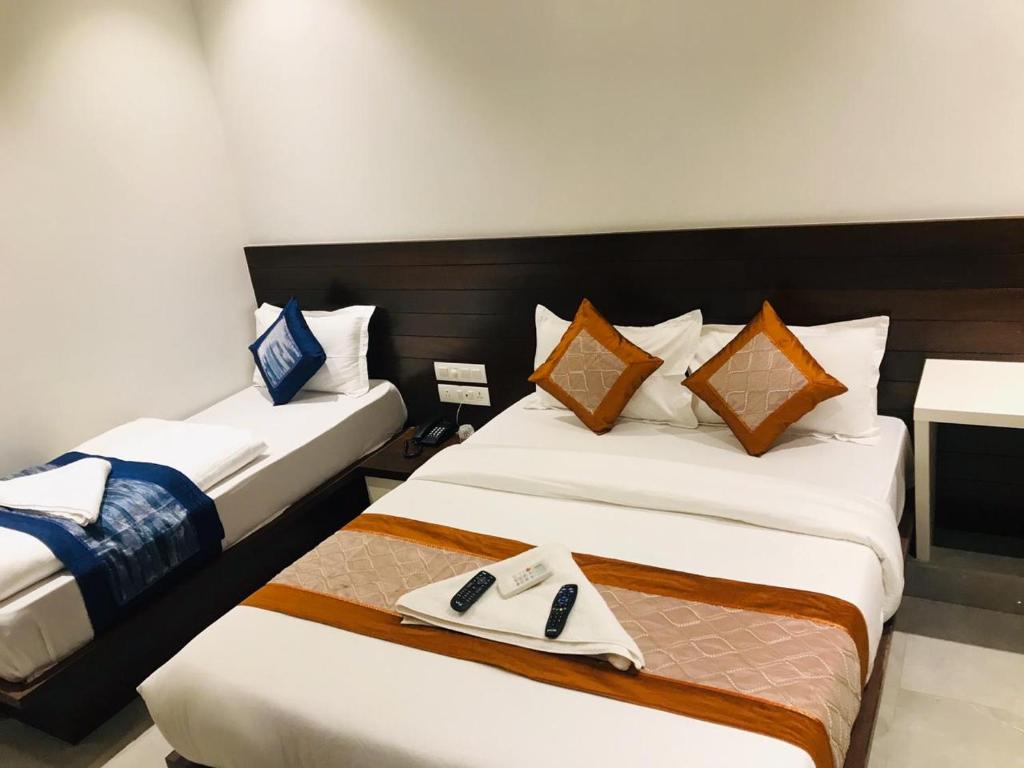 Uma cama ou camas num quarto em Hotel Flora Suites - Fort