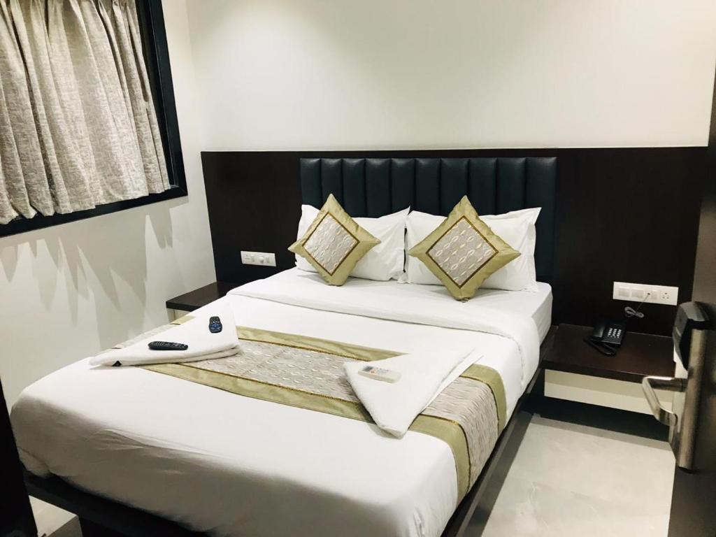 Postel nebo postele na pokoji v ubytování Hotel Flora Suites - Fort