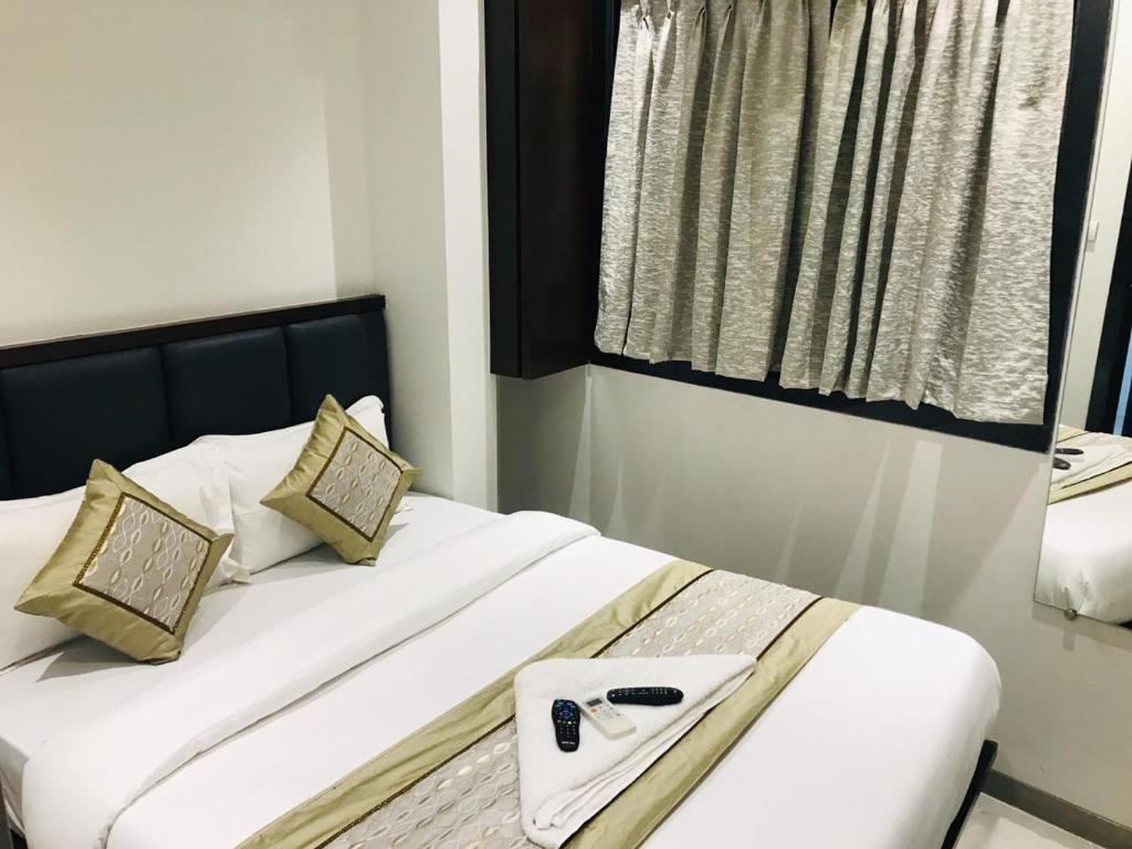 Postel nebo postele na pokoji v ubytování Hotel Flora Suites - Fort
