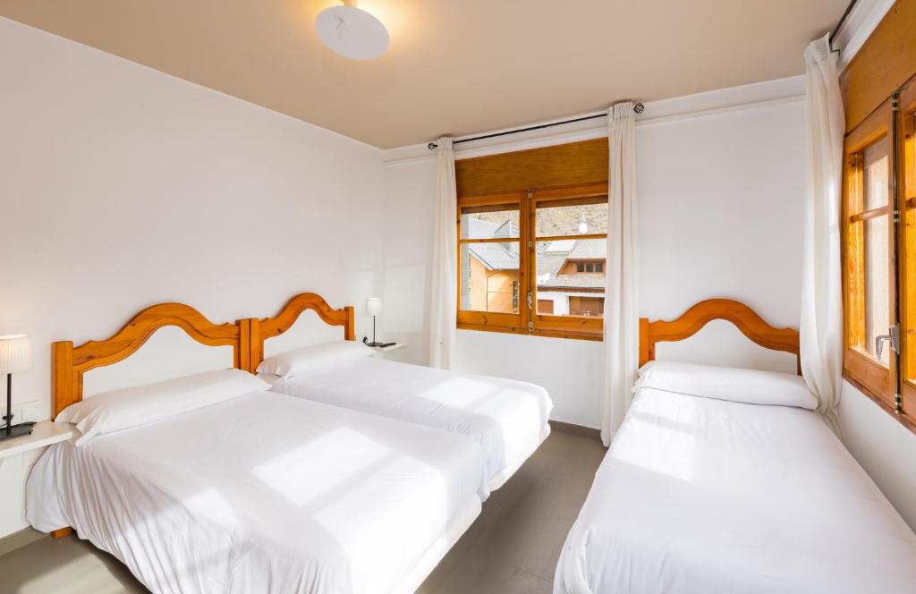 Postel nebo postele na pokoji v ubytování Hostal Trainera