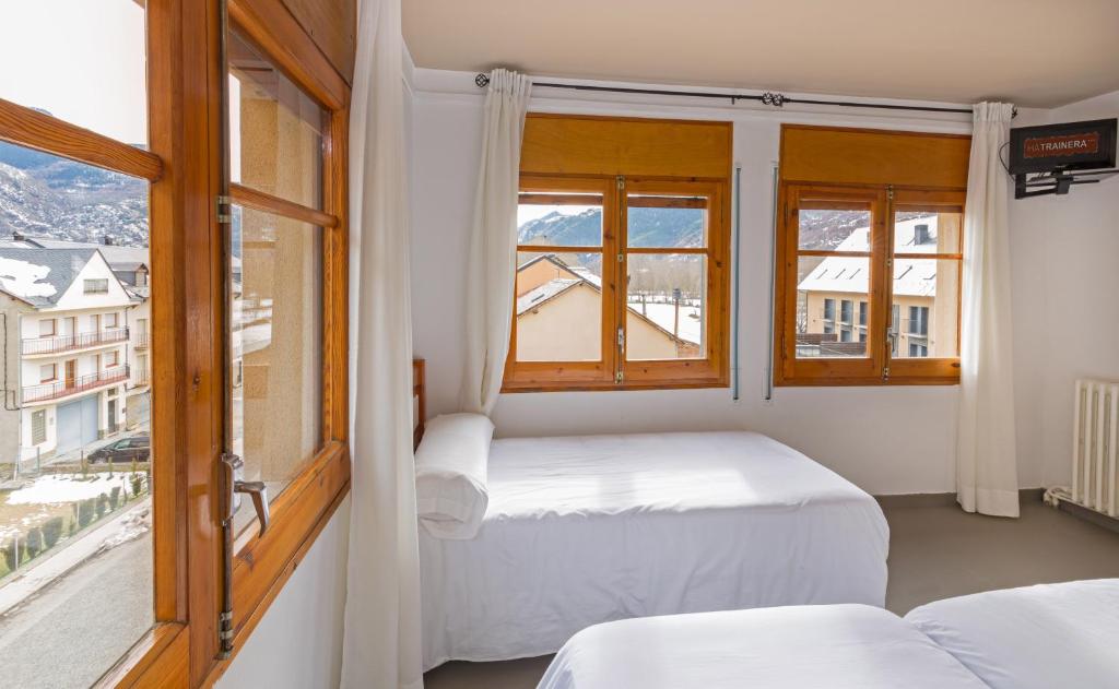 Postel nebo postele na pokoji v ubytování Hostal Trainera