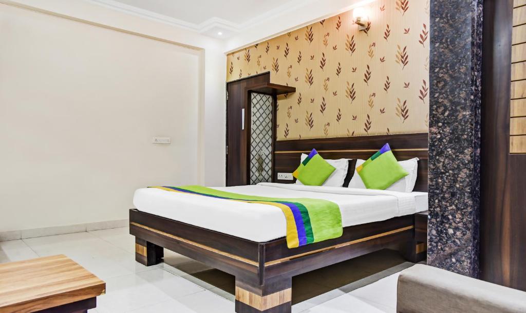 a bedroom with a bed in a room at Treebo Trend Royal Sun Palace MP Nagar Zone 2 in Bhopal