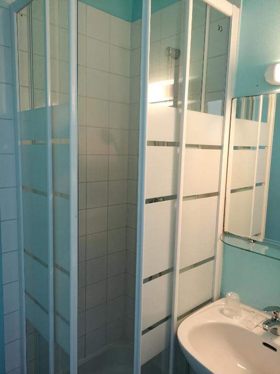 Koupelna v ubytování Hôtel Triotel