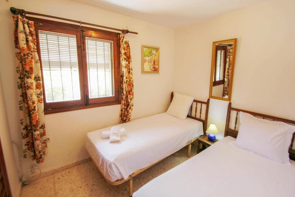 Postel nebo postele na pokoji v ubytování San Jaime 3B - beautiful holiday home in Benissa
