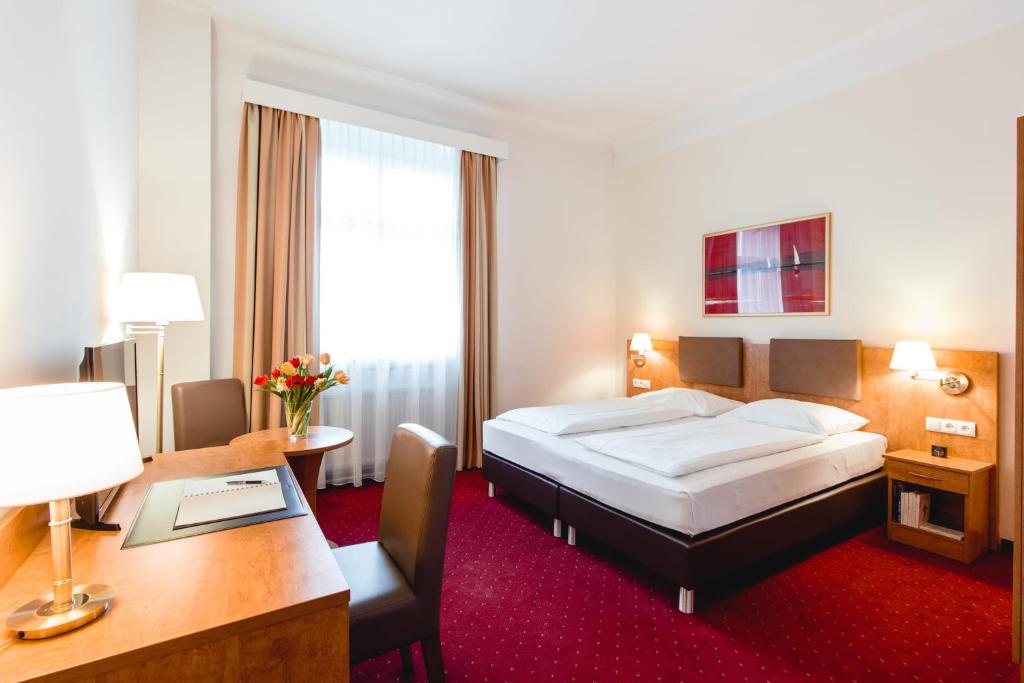 Postelja oz. postelje v sobi nastanitve Hotel Allegro Wien