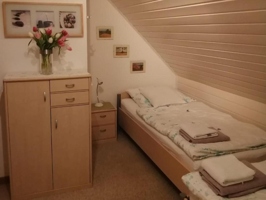 Postel nebo postele na pokoji v ubytování Ferienhaus Hooksiel