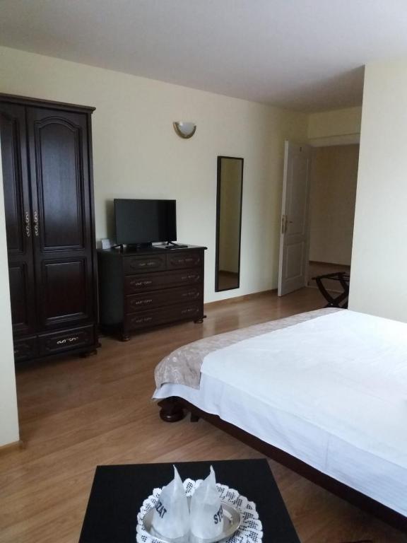 Postel nebo postele na pokoji v ubytování Vila Felix