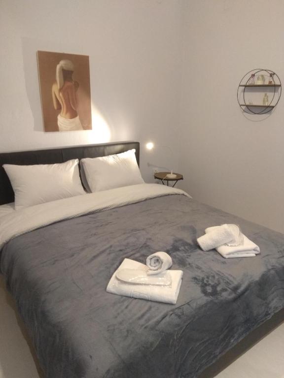 Postel nebo postele na pokoji v ubytování Deppy's Apartments