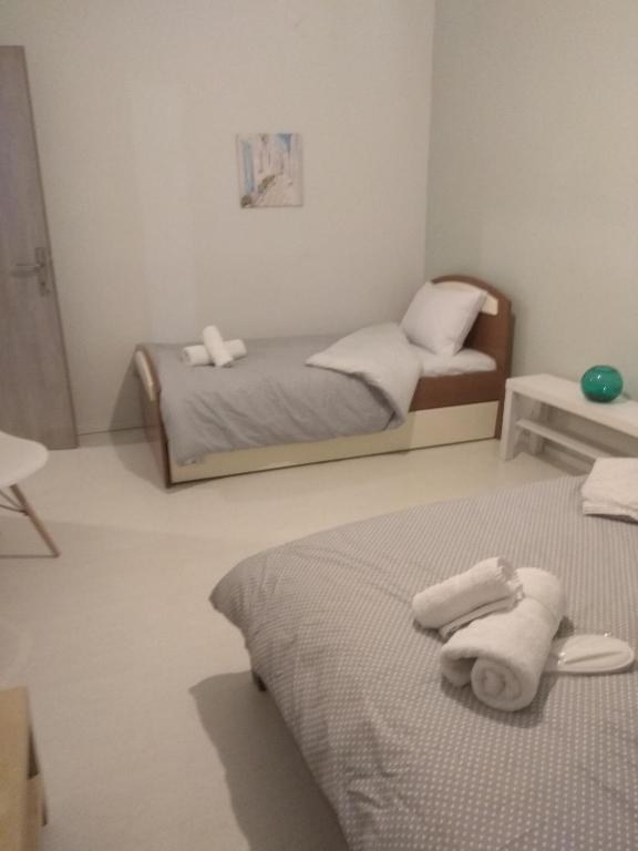 Postel nebo postele na pokoji v ubytování Deppy's Apartments