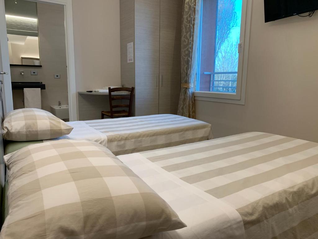 Posteľ alebo postele v izbe v ubytovaní Le 3 Botti Locanda