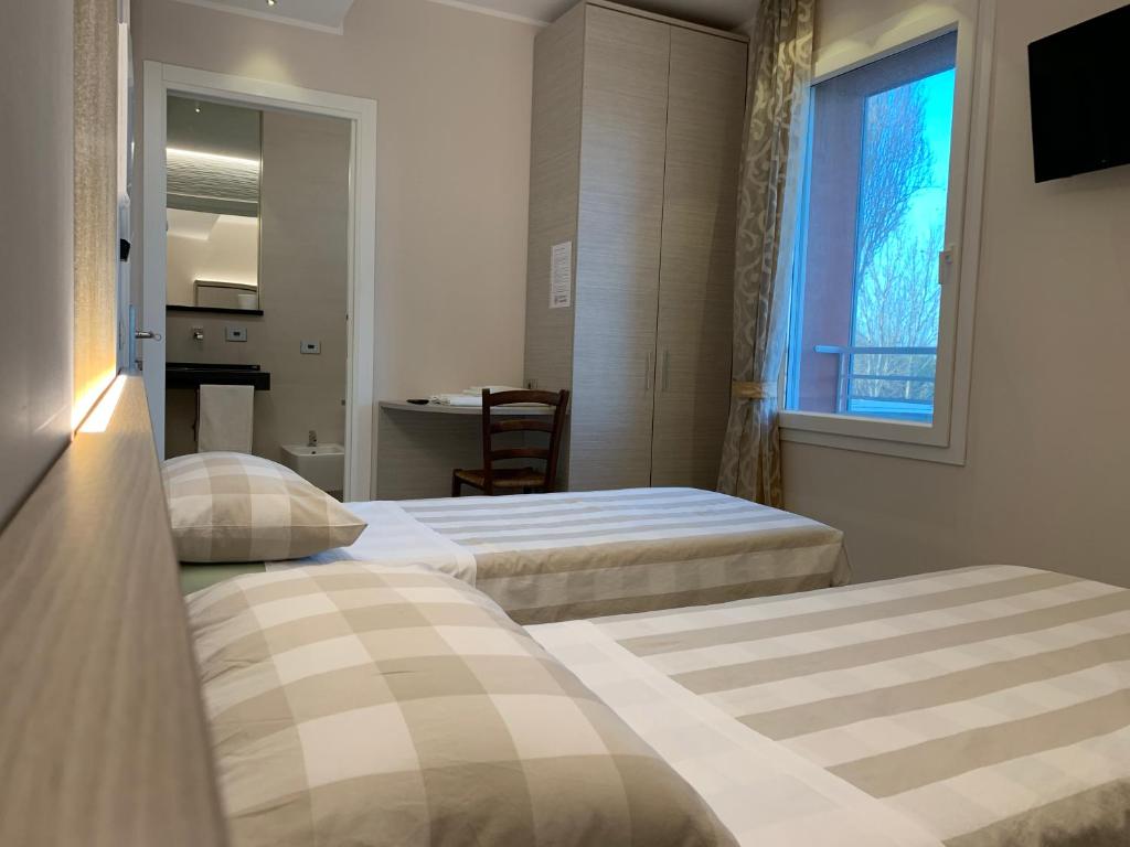 Posteľ alebo postele v izbe v ubytovaní Le 3 Botti Locanda