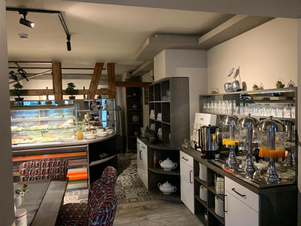 Kuchyň nebo kuchyňský kout v ubytování Hotel Bispinger Hof