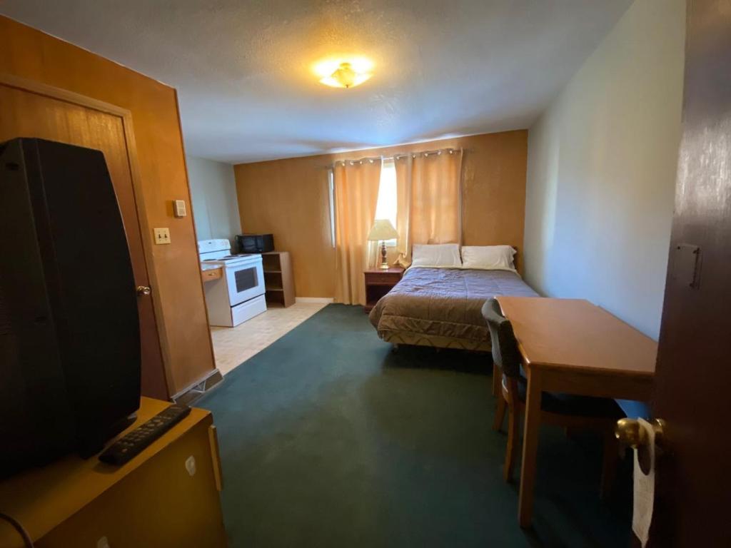 Cama o camas de una habitación en Uptown Motel