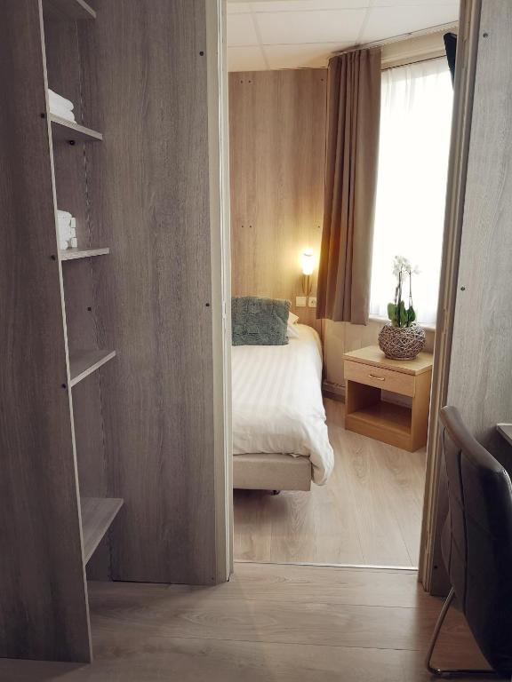 Postel nebo postele na pokoji v ubytování Hotel Sfinx
