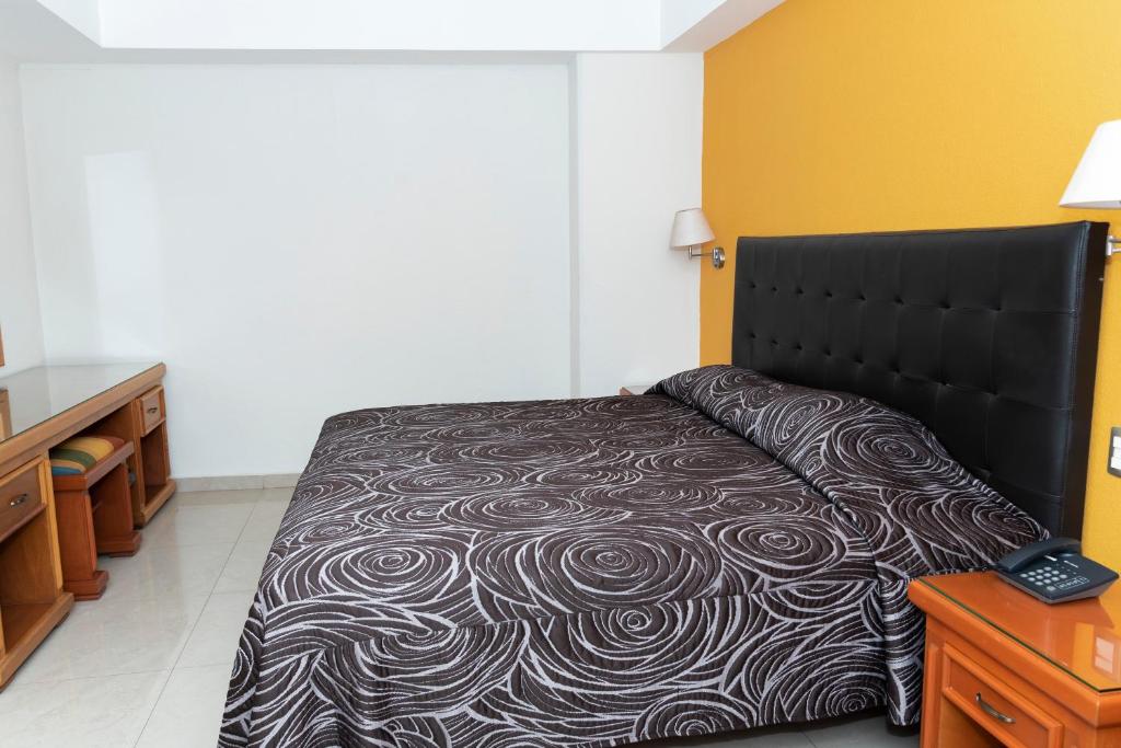 Postel nebo postele na pokoji v ubytování Hotel Gran Via - Centro