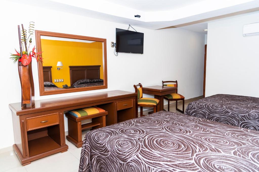 Postel nebo postele na pokoji v ubytování Hotel Gran Via - Centro
