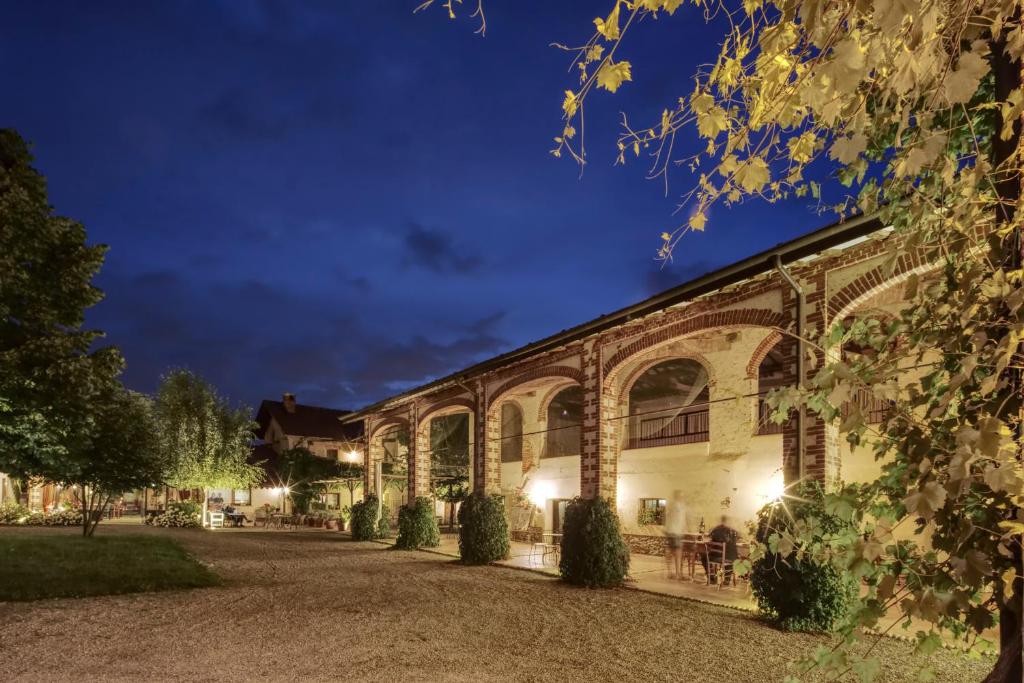 an old brick building at night at Cascina La Commenda in Peveragno